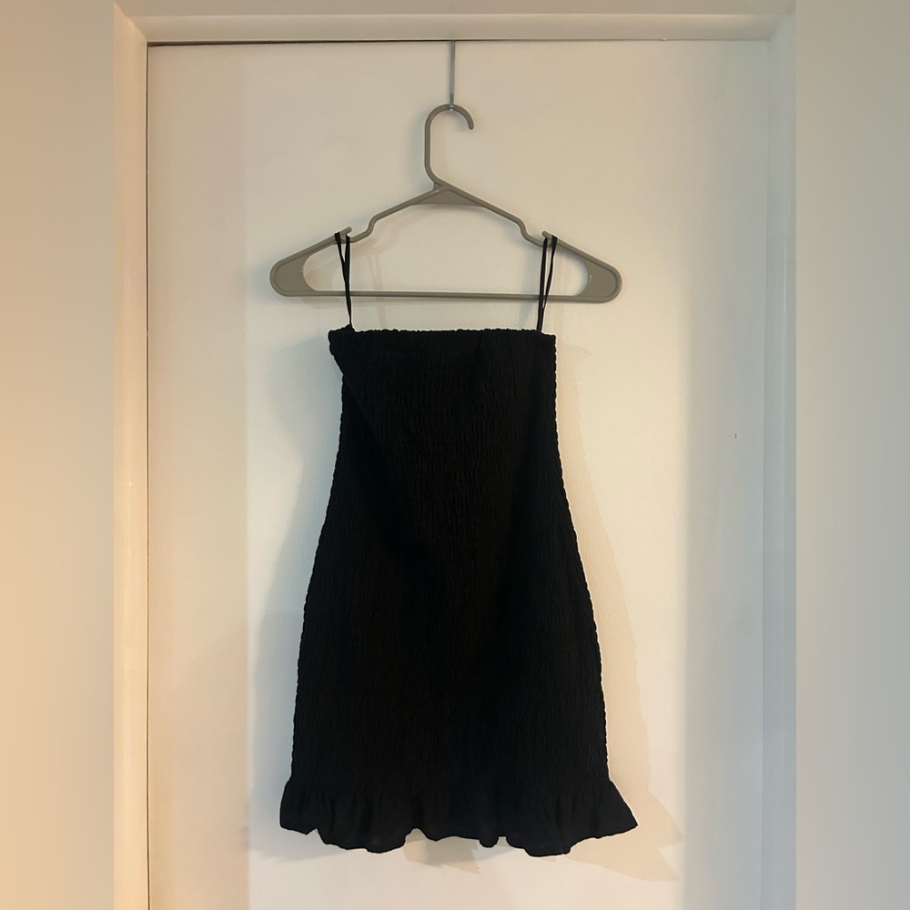 Model smocked black mini dress